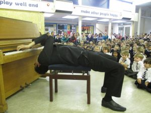 Piano tricks during visit to St Joseph's R.C. Primary, first stop on the Schools Piano Tour 2014